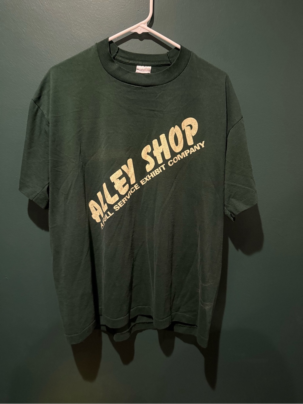 Fruit of the Loom Dark Green 'Riley Shop' Graphic Tee with Cream Logo